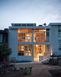 Lucky 7 - Photo 15 of 15 - Architects Ana Henton and Greg Williams broke up the uniformity of the seven town homes by making a feature of the Jeldwin dual-glazed windows, laid horizontally here and vertically on the neighboring units.