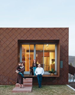 Anne and John pose outside their Cor-Ten steel-clad home with their daughters Claire and Audrey. Read the story about their house (Utah's for LEED for Homes-rated residence) here and check out their kitchen in Dwell's special 100 Kitchens We Love issue, on newsstands April 5, 2011.