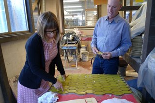 Dwell Patterns with Heath Ceramics - Photo 2 of 3 - Catherine Bailey and Christopher Deam examine a tile board at Heath's factory.