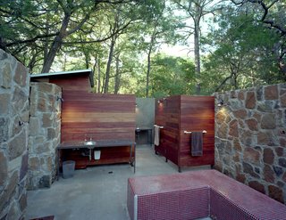 These 13 Outdoor Showers Will Make You Consider One For Your Own Yard - Photo 13 of 13 - With its Brazilian Tigerwood enclosures, the outdoor bathhouse, which includes showers, sinks and dressing areas, references the nearby bunkhouse.