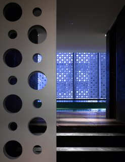 The sliding-gate entrance to the residents' private, 4,900-square-foot pool and gym area.