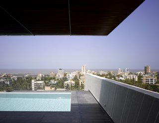 Khanna and Schultz introduced a deep, cantilevered overhang to the owner's terrace, which has a pool and a view of the city and the Arabian Sea.