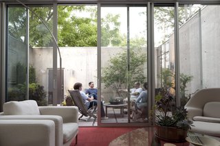 Friends gather in the courtyard to make the most of Minneapolis's limited temperate times.