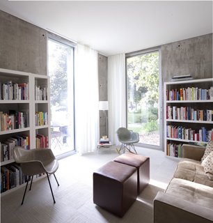 The study houses not only a pair of plastic Eames shell chairs but much of the couple's large collection of architecture and design books.