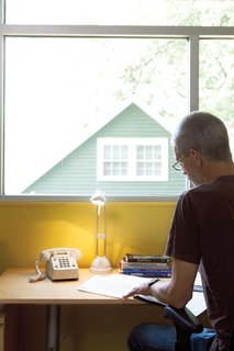 Rick reads in the office upstairs.