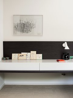 Deam also designed all of the built-in furniture, including this bedside console that features an Arne Jacobsen sconce.