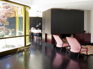 The curving glass and steel wall, designed by Deam and executed by Sand Studios, is a tour de force of engineering and design.