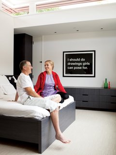 In the master bedroom, Chris designed all of the built-in furniture. The painting is by Mike Monteiro.