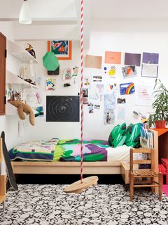 In addition to a swing, Cal's room features Maija & Kristina Isola's Sola bedding for Marimekko.