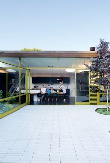 Unable to alter the footprint of the building, the Deams created a backyard living area that nearly doubled the home's living space.