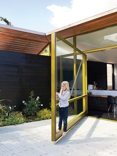 Thanks to clever engineering by Sand Studios, seven-year-old Macy can operate the 2,000-pound door.