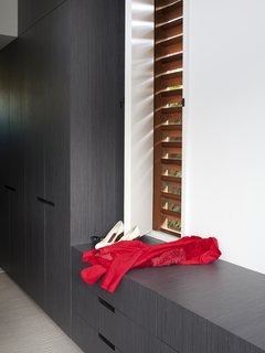 Open a tidily tucked away pocket in the wall, and you'll find a screened aperture with louvers.