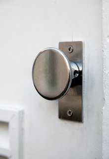 Isaacson designed the steel door handle and had it milled by local machinists in Lewiston.
