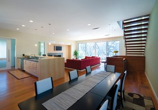 Triangle House Tours - Photo 3 of 30 - This approach allows for an extremely efficient use of space, leaving the smaller, existing bedrooms and living areas to be used as guest spaces and the new construction to be as large and open as possible. The material palette remains in context, while the execution and form make a decidedly modern statement.