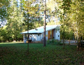Triangle House Tours - Photo 12 of 30 - The exterior corrugated galvalume siding responds to the surrounding rural farm areas and more importantly, diminishes maintenance to afford the homeowners additional quality time for preferred activities.