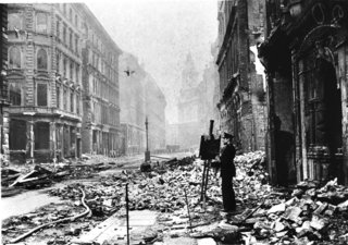 Lapham's Quarterly on the City - Photo 2 of 2 - This photograph of Bernard Hailstone painting in Blitz ruins is from the Art Archive / Imperial War Museum / Eileen Tweedy. Courtesy Lapham's Quarterly