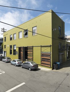 The 1940s-era building was scheduled for demolition before the Sands purchased it in the early aughts and transformed it into their workshop, offices, and home. The space was nearly in ruins when the couple bought it and they used recycled or salvaged materials wherever possible in the renovation and even fabricated the metal work in the first-floor shop.