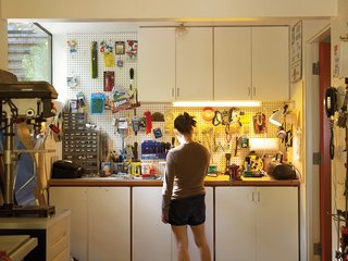 A garage full of cupboards can’t contain Orpilla’s toolkit.