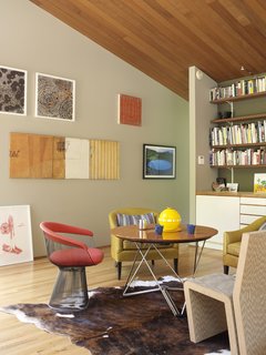 For a slightly funkier feel, opt for a variety of high-design chairs around your table. A less rigid approach to hanging art can also ease the hard lines of much modern decor and add to a more bohemian vibe to your home.
