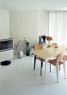 Architect Makoto Tanijiri’s firm custom-designed most of the furniture in the building, including the steel-and-paulownia dining table.