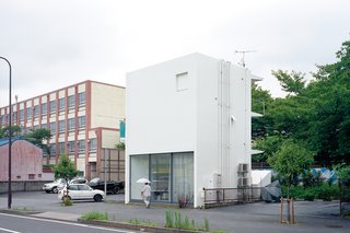 The structure is an elegant riff on the boxy apartments and school that surround it.