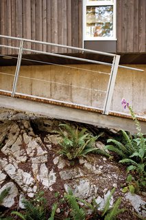 Farther down on the site is a dock whose ramp is lowered by hand via weight-laden pulleys. The residence is accessible by private boat or water taxi only.