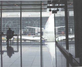 Here's a photo from Terminal 5 out toward one of the waiting jets. The photo is by Richard Baker, who took a number of seemingly pedestrian photos for the book that actually reveal much of the poetry of the terminal.