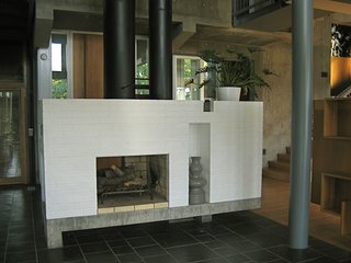 The hearth is central, and like the rest of the house, reassuring in its classism, in both proportion and assembly. While in a way austere, the richness of material keeps the house from feeling cold or operational. Still, it has to be understood as an exercise in Architecture for architectures sake, high couture, embracing certain abstract ideas of architecture and not necessarily a practical application in society.