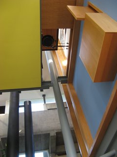 Above the fireplace, one can see the confluence of three bi-level cubes comprising apartment-volumes for parents (master suite), children, and public (piazza). And while the totality might elaborate notions of mansion-house or programs like foyer and hallway for example, one must traverse a network of stairs, exterior balconies and interior bridges, which seem to confound clear notions of programmatic space.