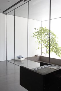 Atherton's bedroom also contains a miniature piano; outside is a red bud tree, an appealing spot for mellow contemplation.