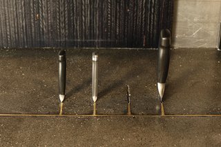 The kitchen has many custom touches, like this inset knife holder built into the countertop.