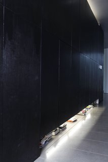 The secret to keeping their minimalist interiors spare? Lots of hidden storage in the hallway, where they stash their books, their clothes, their tools, and their climbing gear.