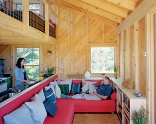 The interior is furnished with Lubi Daybeds from CB2, which Howell and Porter designed to include hidden cubbies behind and beneath the cushions.