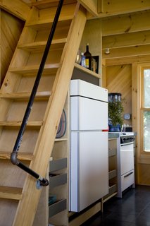 Howell was creative in his space-saving techniques as well as for practical matters. The handrail for the stairs to the loft was pieced together with lengths of PVC pipe and plumbing hardware.