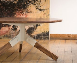Furniture Design: Misewell - Photo 4 of 5 - The Conrad coffee table has a solid walnut top and legs; each leg snaps into the stamped steel bracket without the use of hardware.