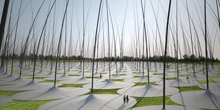 "Windstalk," which won a second place mention from the jury, is a field of jumbo-sized, reed-like poles that collects kinetic energy from the blowing wind. Whether imagining huge hair follicles or towering blades of grass, the atmosphere will likely make visitors feel like they’re in a scene from "Honey I Shrunk the Kids."<br><br>Design by: Dario Núñez Ameni and Thomas Siegl, with Atelier dna
