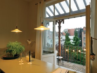 Kind of New - Photo 3 of 15 - The elegant olive dining table is a traditional German beer-garden table the couple bought second hand and painted.