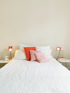 Kind of New - Photo 9 of 15 - The orange his-and-hers lamps in the bedroom came from Högner's sister's childhood bedroom. "My sister prefers new things," said Högner. "But my dad can't throw anything out.