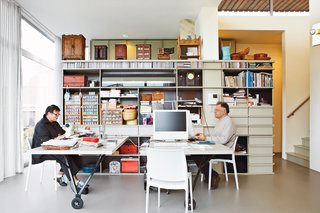 In the work space, custom shelving houses crafting materials (Blans is a keen needle woman) and objects, including toys from Blans's mother's childhood.