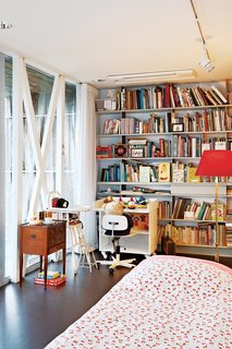 The cozy spare room filled with heirlooms is largely used by the couple's three young grandchildren.