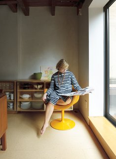 Family Home Renovation in Brooklyn - Photo 8 of 28 - Lange reads the newspaper in a vintage Pierre Paulin Little Tulip chair for Artifort.
