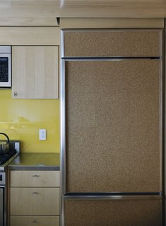 Family Home Renovation in Brooklyn - Photo 16 of 28 - A fridge clad in cork provides a decidedly warm touch to the kitchen.