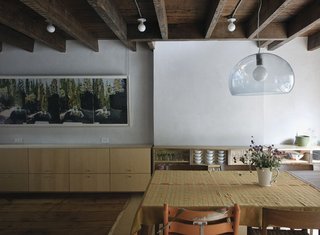 Family Home Renovation in Brooklyn - Photo 17 of 28 - An icy-blue Kartell FL/Y pendant light adds a distinctly contemporary touch to the rustic English basement level.
