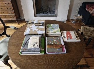 Family Home Renovation in Brooklyn - Photo 27 of 28 - Paul Rudolph, Eero Saarinen, Corbu, and Paul Rand account for a dose of the couple's reading material.