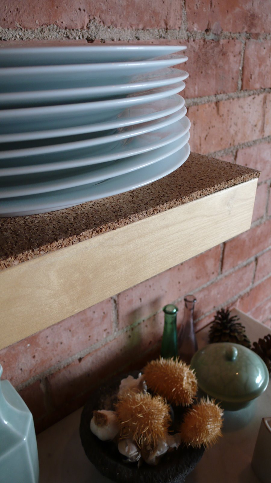 We relined the existing kitchen shelves and drawers with cork sheet material from Linoleum City.