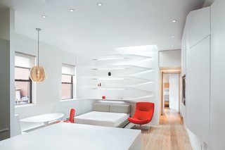 In the apartment’s new incarnation, the main living area is a family room that morphs—after the boys go to sleep in the back bedroom—into the parents’ lair. As Krastev puts it, "During the day it’s a one-bedroom apartment, at night, a studio."