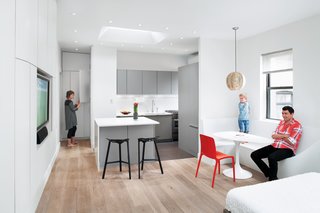 Since the main living space has to function as both a bedroom and a family room, Krastev and Nikolova make do without a couch. When the family watches TV or reads, they cozy up on the bed or sit on the built-in bench, which also serves as a dining and play area. "When in a limited space, you have to really think: What do we do in this room, what do we need?" says Krastev. "Do we really need a coffee table?" In their case, the answer was no.
