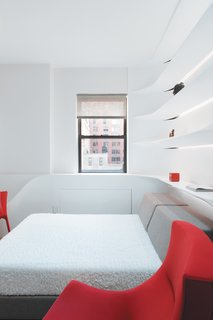 "Corian is often pooh-poohed because it’s used for ugly stuff, like bathroom vanities," says Schoenenberger, "but we knew what we wanted to achieve would be difficult with plaster." The eye-catching sculptural wall above the bed is crafted from the material.