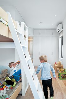 For now, Kimi, age six, and Darin, age two and a half, happily share a room and bunk bed. Kimi’s clothes are stored on low shelves in the built-in closet, so he can dress himself, and the children’s toys are stored within easy reach in open drawers.