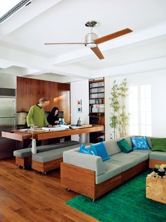 An adjustable dining-room table is relatively common in Europe, according to the couple, who ordered their hydraulic legs from Switzerland. They allow for up to four presets, so the Garneaus have one for dining, one for working, and two for cooking, depending on who’s the chef. The table itself was designed by Robert’s firm, Studio Garneau, and has five drawers in it, some big enough to store Robert’s oversize flat artwork. skf.com<br><br>Don't miss a word of Dwell! Download our FREE app from iTunes, friend us on Facebook, or follow us on Twitter!